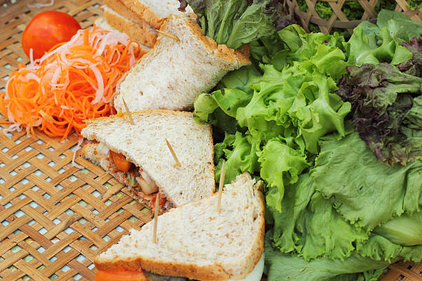 istock making tuna sandwich with fresh vegetables 516221965