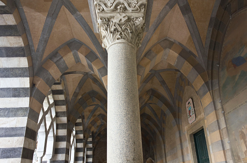 Amalfi, Italy, August 11, 2014: Amalfi Cathedral  (it.Duomo di Amalfi), external colonnade. The church is dedicated to the Apostle Saint Andrew. Predominantly of Arab-Norman Romanesque architectural style