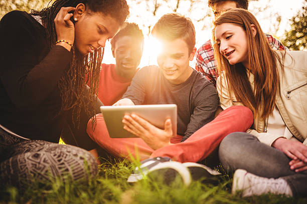 istock Group of college student laughing and studying togetherness 516229301