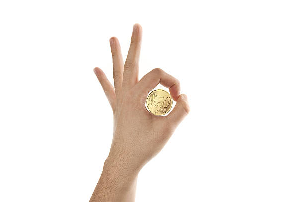 istock Hand ok sign and 50 cent coin 516229413
