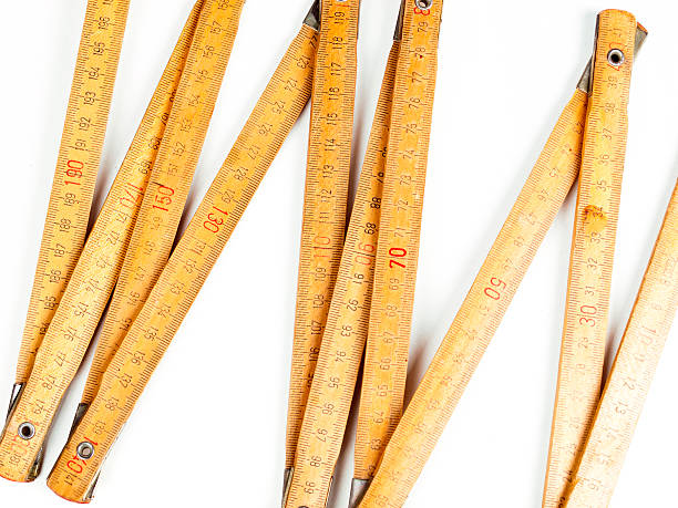 istock close up of a carpentry ruler on white background 516230659