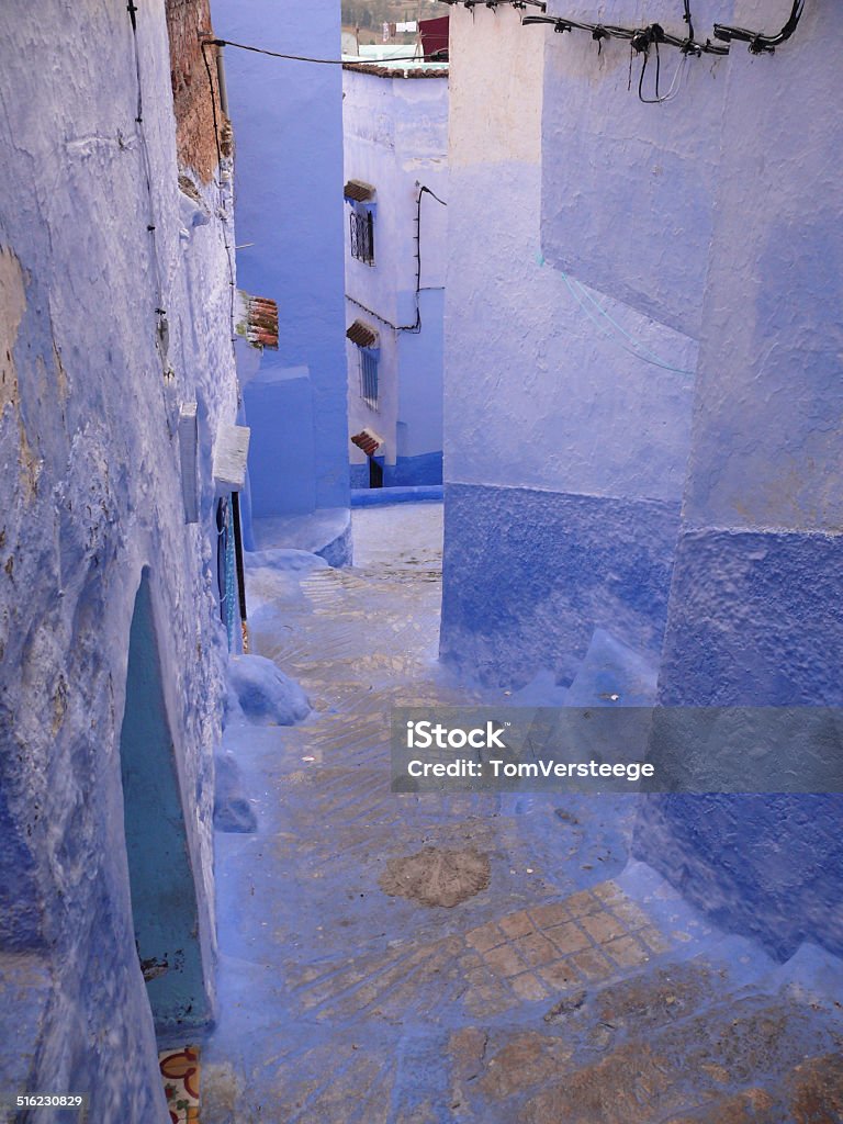 Backstreet of the Blue City of Chefchouen Blue-painted backstreet in the medina of the Berber city Chefchouen, north Morocco. Africa Stock Photo