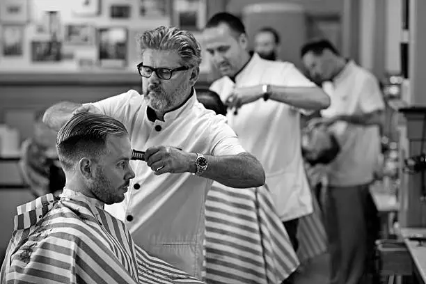 Photo of barbers at work