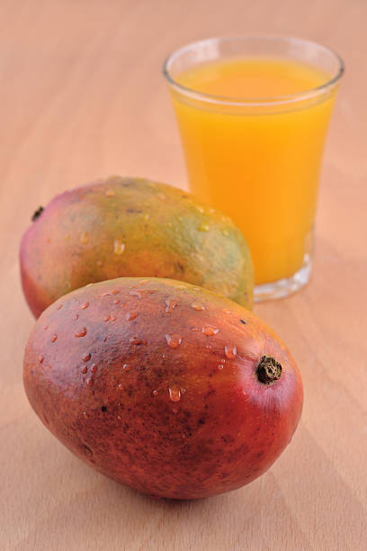 istock Mango and a glass of mango juice 516231029