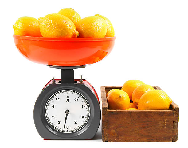 istock Lemons on scales and in a box 516231685