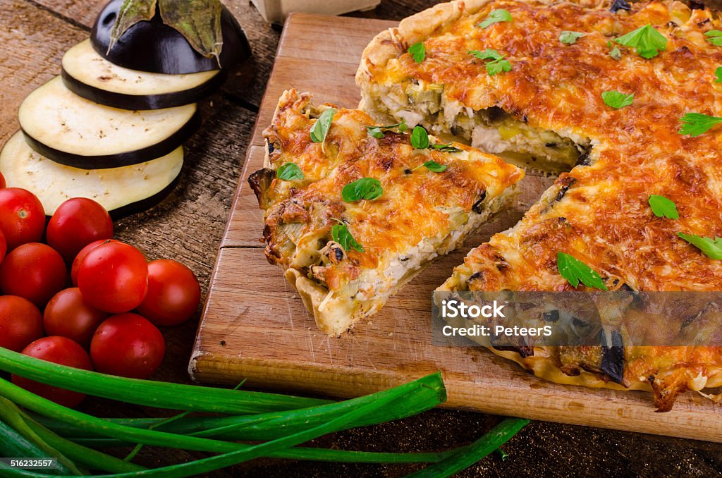 French Quiche vegetarian French Quiche with eggplant, leeks and spring onions, bathed in a delicious cream and baked until crisp Baked Stock Photo