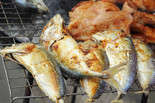 istock lot of mackerel on the grill 516232975