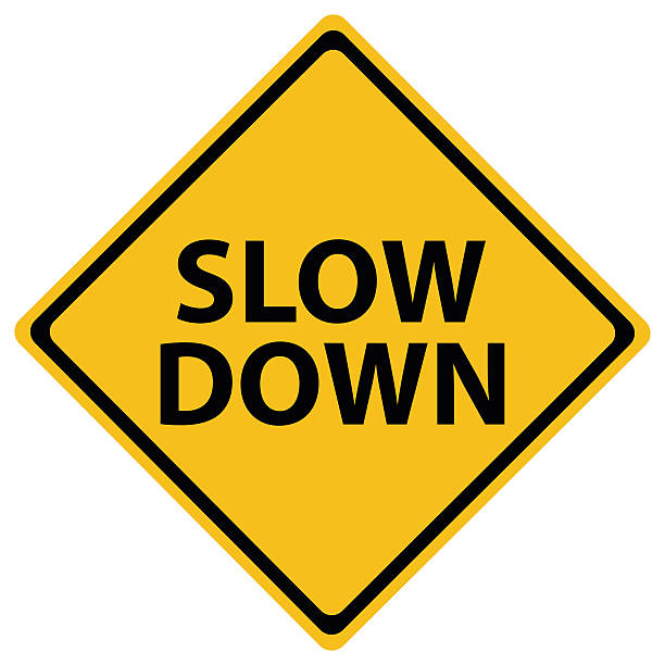 Slow Down Slow Down yellow road sign isolated on white slow stock illustrations