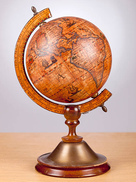 istock An old brown vintage globe on a small stand 516235587