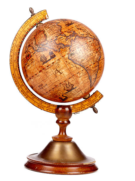 An old brown vintage globe on a small stand stock photo