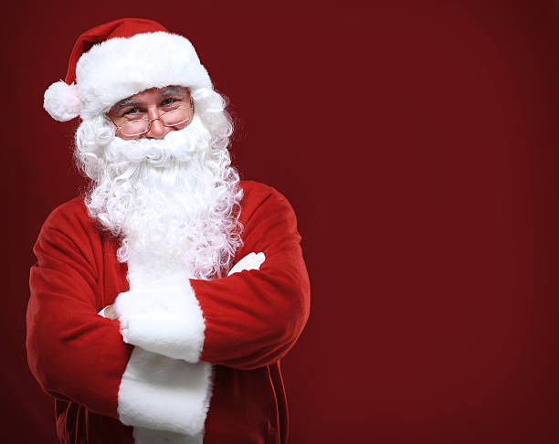 istock happy Santa Claus in eyeglasses looking at camera 516235739