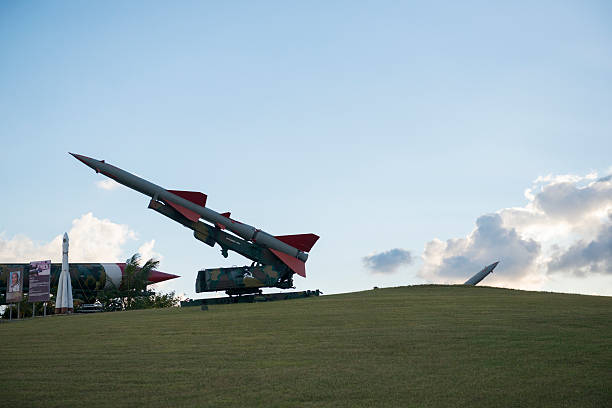 October Cuban Missile Crisis display in Havana, Cuba Havana, Cuba - December 17, 2014: A missile is on display on the grounds of the Parque Historico Militar Morro-Cabana in Havana, Cuba. Located on a grassy hillside and viewable from a public road, it is part of a commemoration of the 1962 October Crisis. cuban culture photos stock pictures, royalty-free photos & images