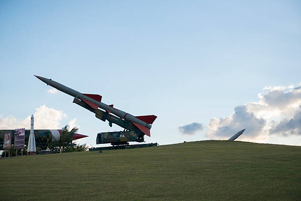 October Cuban Missile Crisis display in Havana, Cuba Havana, Cuba - December 17, 2014: A missile is on display on the grounds of the Parque Historico Militar Morro-Cabana in Havana, Cuba. Located on a grassy hillside and viewable from a public road, it is part of a commemoration of the 1962 October Crisis. morro castle havana stock pictures, royalty-free photos & images