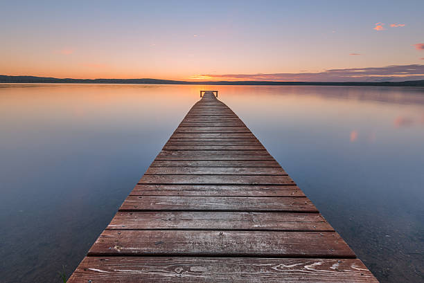 istock Old wooden pier on sunset 516238118