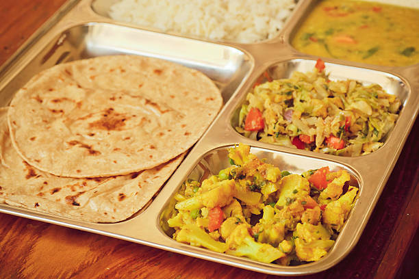 istock Selective focus on metal tray with Indian thali, subji, rice 516238568