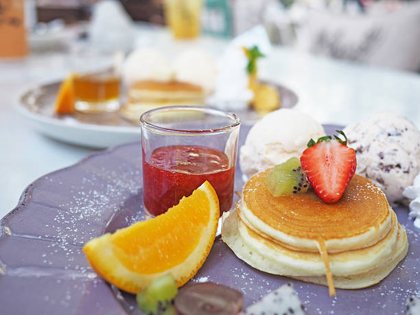 istock Pancakes with fruits and strawberry sauce 516240050