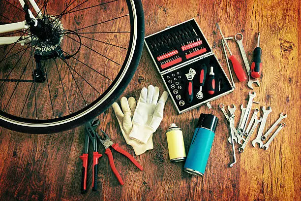 Concept of repairing or maintenance bike with tools and bottles