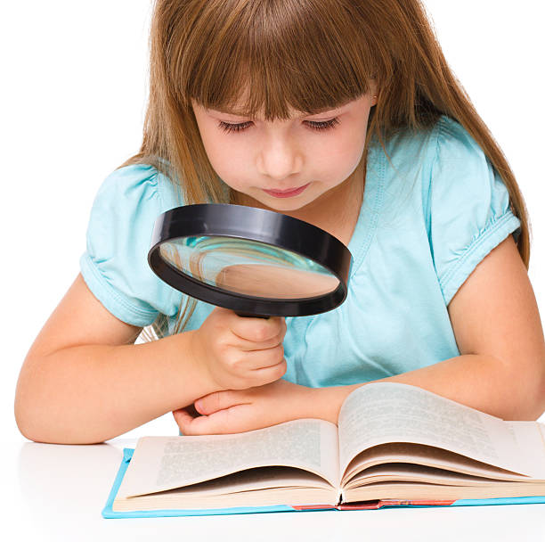 istock Cute girl is reading book 516245361