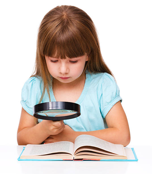 istock Cute girl is reading book 516245379