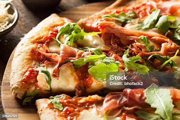 Prosciutto And Arugula Pizza Stock Photo - Download Image Now - Arugula, Baked, Basil