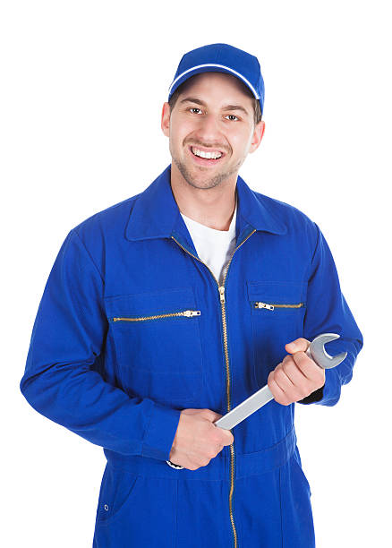istock Mechanic In Blue Overalls Holding Spanner 516247393