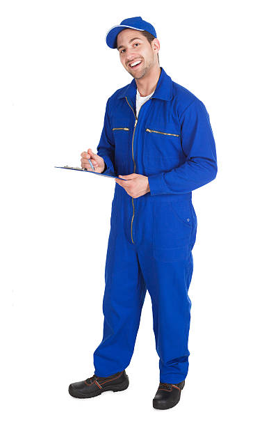 istock Mechanic In Overall Writing On Clipboard 516247397