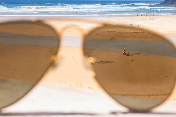 unique view of the beach trough sunglasses