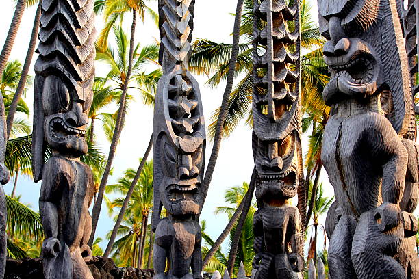 Hawaiian Tikis Standing at the Place of Refuge, Kona, Hawaii Image of Tikis taken in Kona, Hawaii 12/2012. big island hawaii islands photos stock pictures, royalty-free photos & images