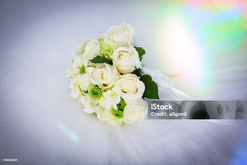 Wedding bouquet Wedding bouquet of white roses on a white veil Adult Stock Photo