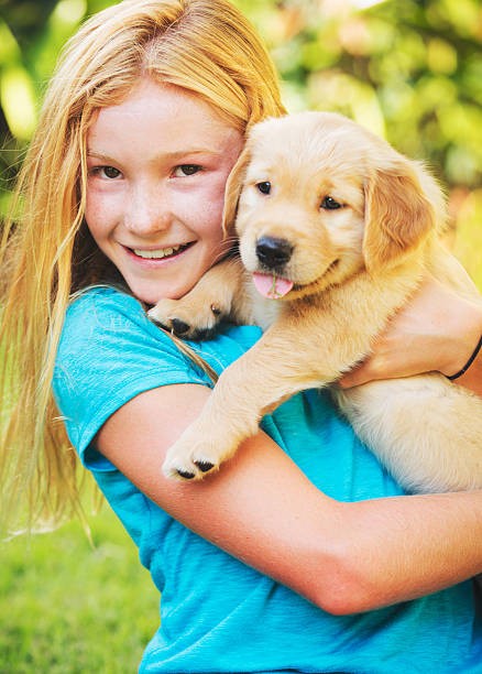 istock Girl with Puppy 516251343