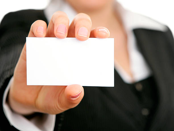 istock Blank business card in a hand (female) 516251528