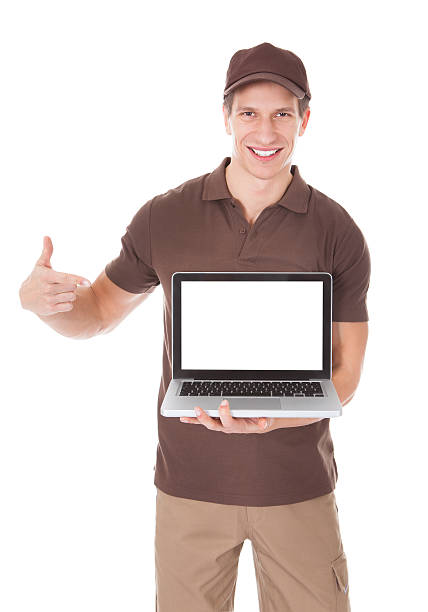 istock Delivery Man Holding Laptop 516251877