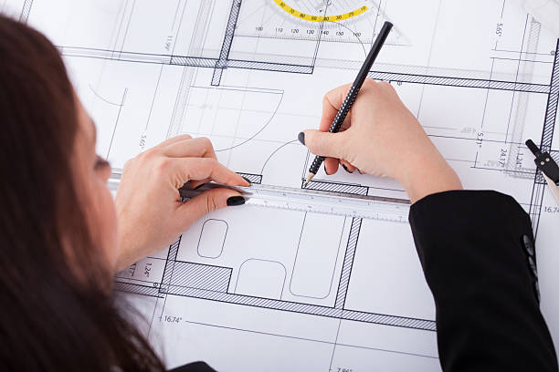 istock Businesswoman Making Blueprint 516252463