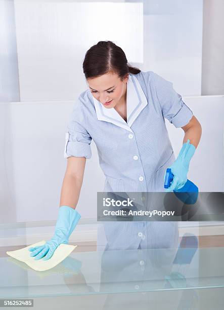 Happy Maid Cleaning Glass Table Stock Photo - Download Image Now - Adult, Adults Only, Bottle