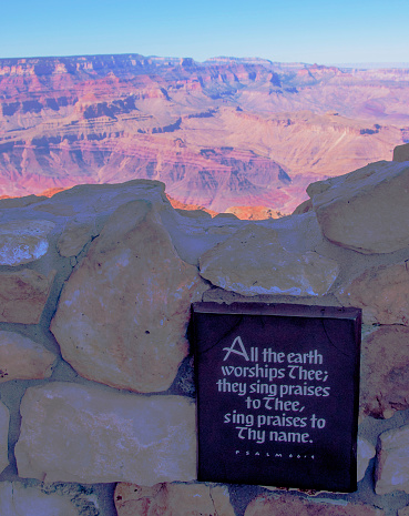 This plaque with an ancient Bible verse about the grandeur of Earth was placed at the Grand Canyon Desert View watchtower built on the South Rim. The watchtower was constructed as a replica from the Anasazi native American culture and opened in May 1933.