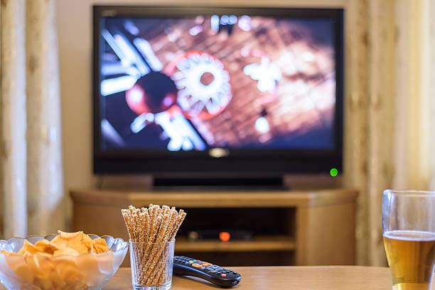istock Television, TV watching (basketball game) with snacks and alcohol 516252556