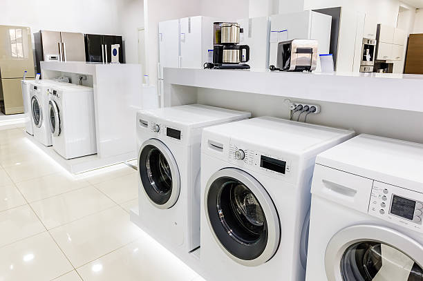 istock washing mashines in appliance store 516253160