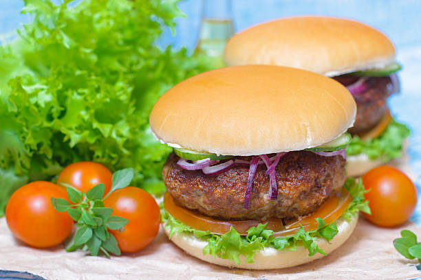 istock Juicy burgers hamburger with a big beef cutlet, tomato, lettuce 516253668