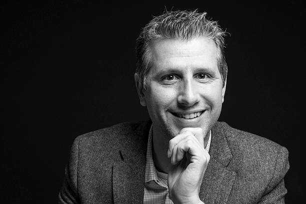 istock attractive businessman portrait looking happy at camera 516254136
