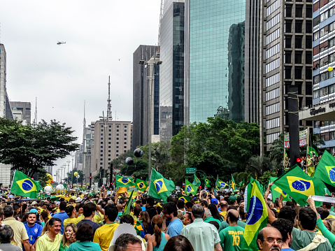 São Paulo, Brazil - March 13 2016: In the photo is possible to see people  participating in manifestation on Paulista Avenue in São Paulo.center of the majors manifastations of the city, and where happened the greatest demonstration of dissatisfaction with a government in the history of Brazil. It was possible to see people of all ages and social classes fighting for the same ideal, the fight against corruption in politics, the political party PT and calling for the resignation of President Dilma Rousseff