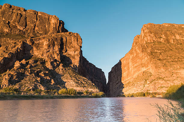 The sunrise on the cliffs of Santa Elena Canyon at Big Bend National Park produces vibrant colors.