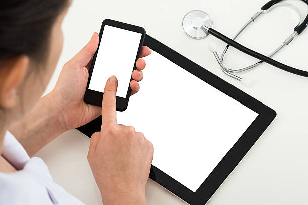 istock Doctor With Blank Display Mobile Phone And Digital Tablet 516258752