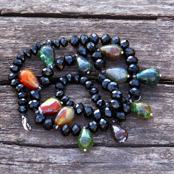 istock Beautiful necklace of jasper and black quartz beads 516260188