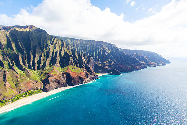 aerial view of kauai stunning aerial view of na pali coast at kauai island, hawaii from helicopter kauai photos stock pictures, royalty-free photos & images