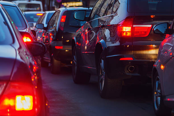city traffic at dusk city traffic at dusk tail light stock pictures, royalty-free photos & images