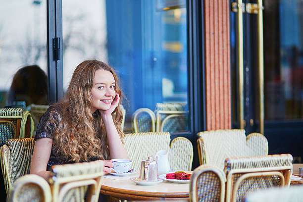 istock Beautiful Parisian woman in cafe 516260978