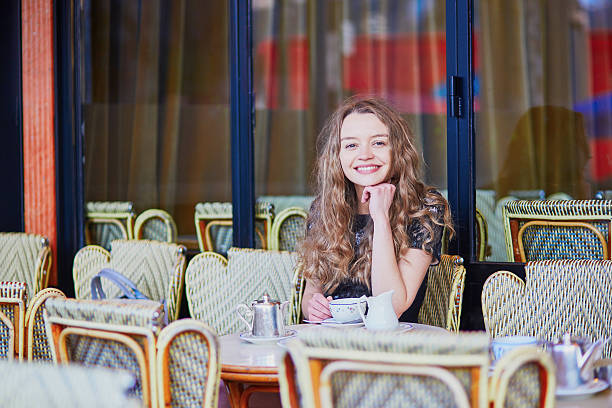 istock Beautiful Parisian woman in cafe 516261110