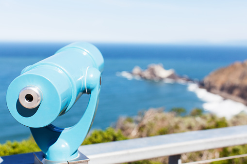binoculars overlooking gorgeous rocky seashore
