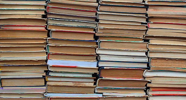 istock Stacks of old hardback and paperback books 516264230
