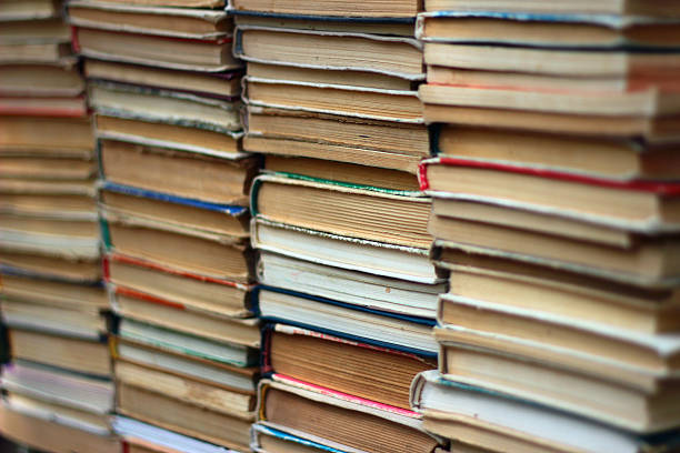 istock Stacks of old hardback and paperback books 516264274